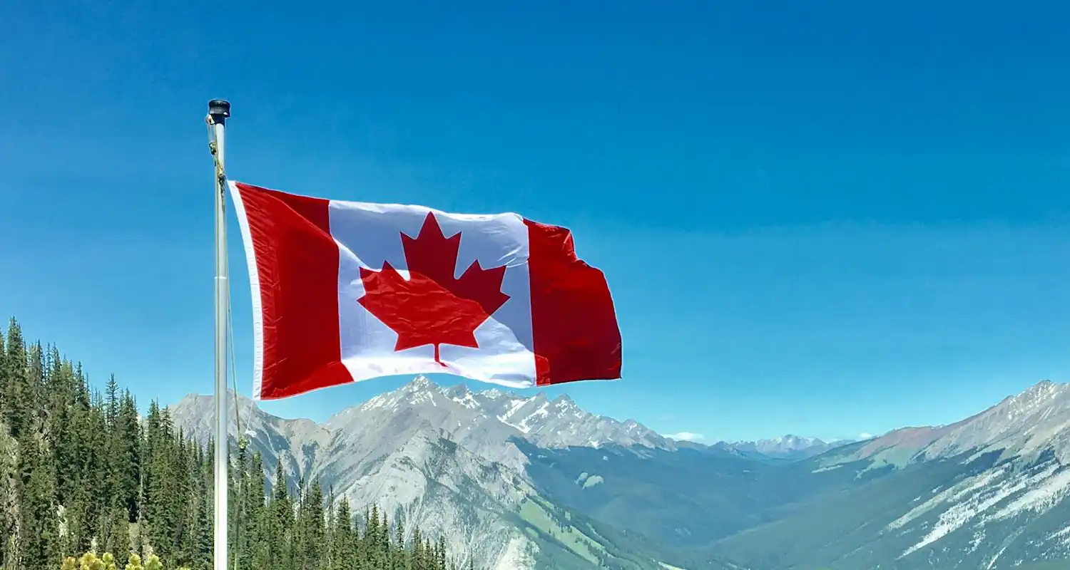 Candian flag on mountains